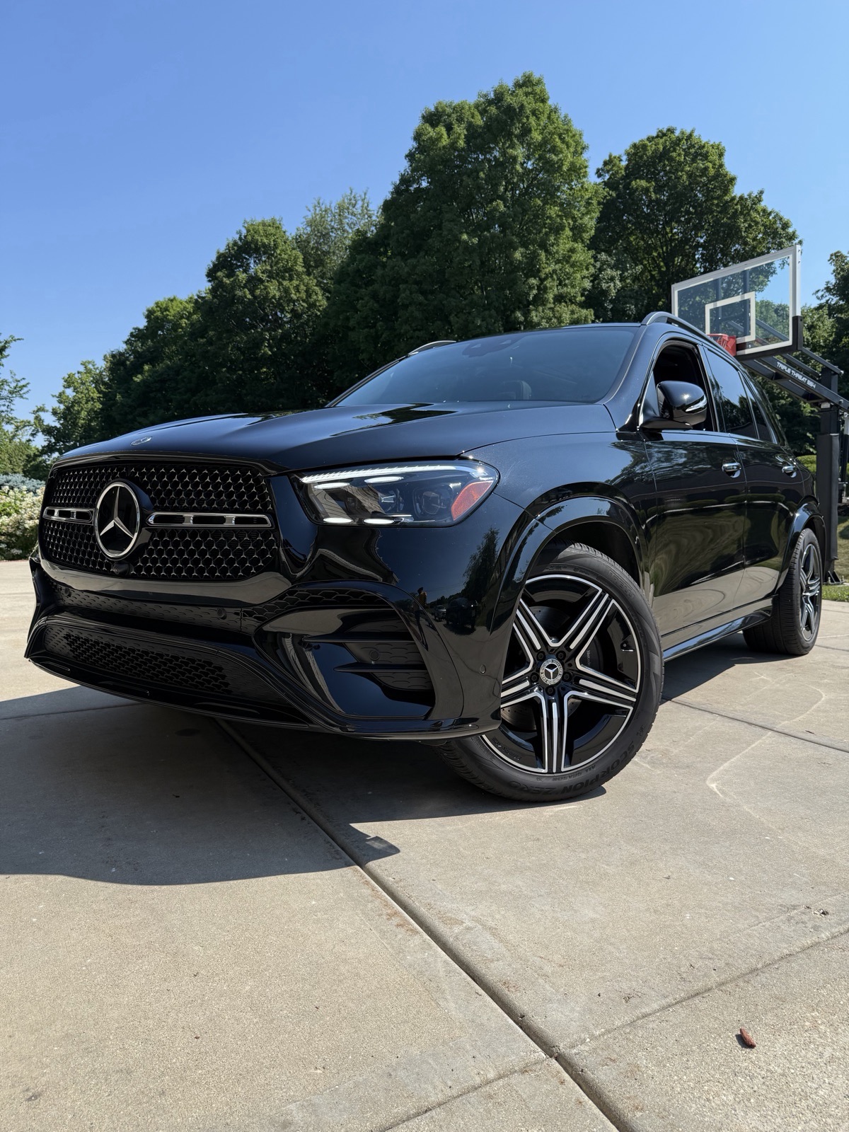 Black Mercedes SUV after a full detail, front three-quarter view